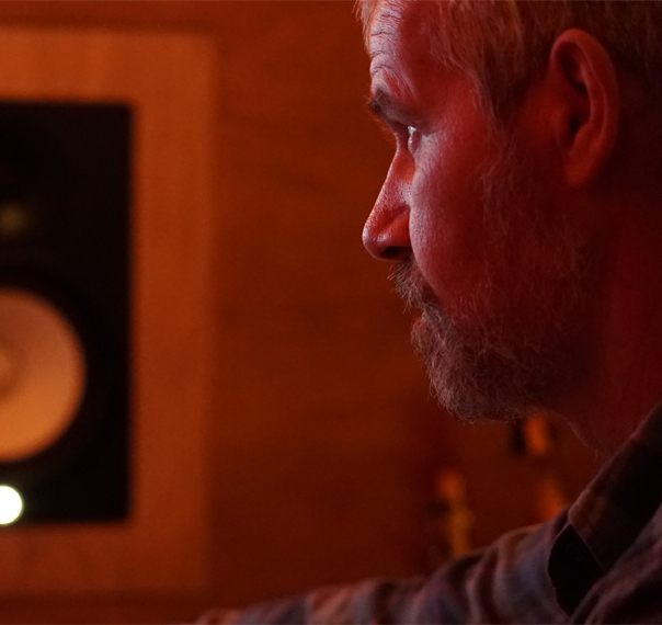 Luke Stidworthy staring at monitor at Vox Music Recording Studio in South Manchester