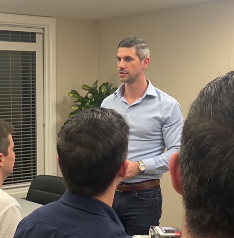 Adam Bair leading a strategic workshop for entrepreneurs, discussing business resilience and growth 