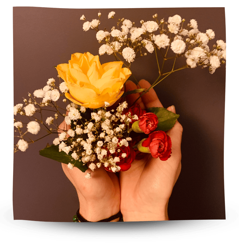 Martina holding flowers in her hands