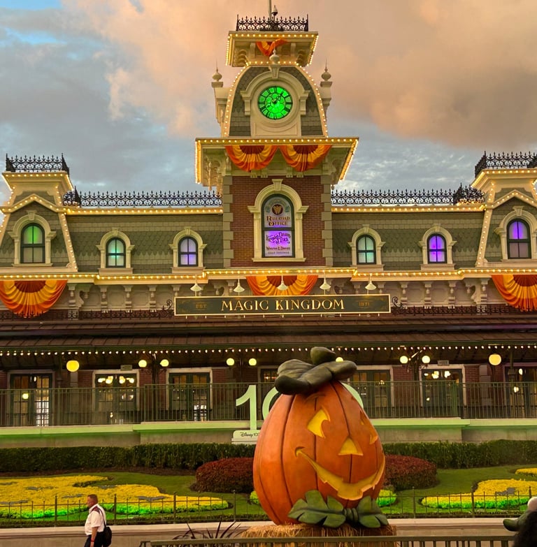 Magic Kingdom Train Station, decked with orange banners for Mickey's Not-So-Scary Halloween Party.