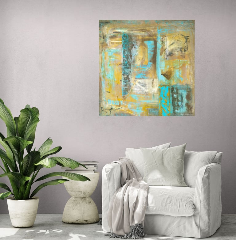Wall art in ochre and turquoise in lounge chair setting with palm tree