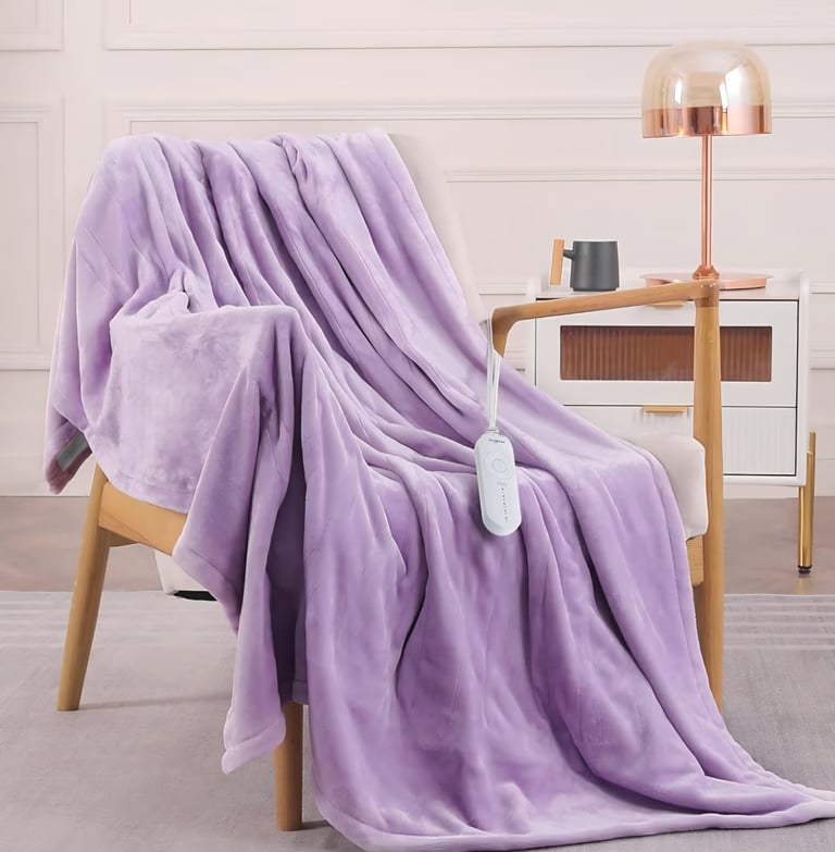 HOMLYNS LuxeHeat heated blanket with adjustable heat settings for cozy comfort indoors.