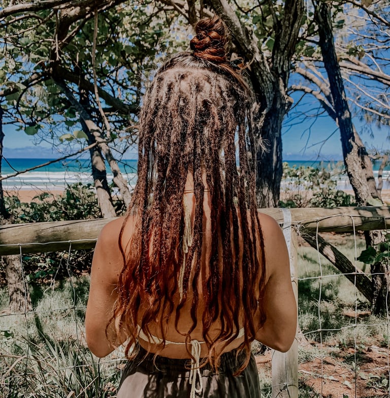 a woman with dreadlocks in her hair