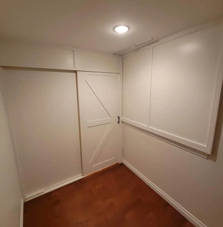 a cozy private room with a sliding door and a sliding door