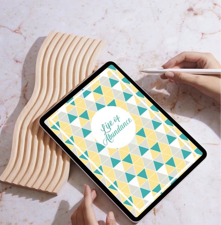 Digital planner on a tablet with a stylus on a marble surface for productivity and organization.