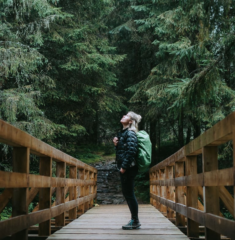 a photo of a woman in the forest at the tatra mountains Poland 