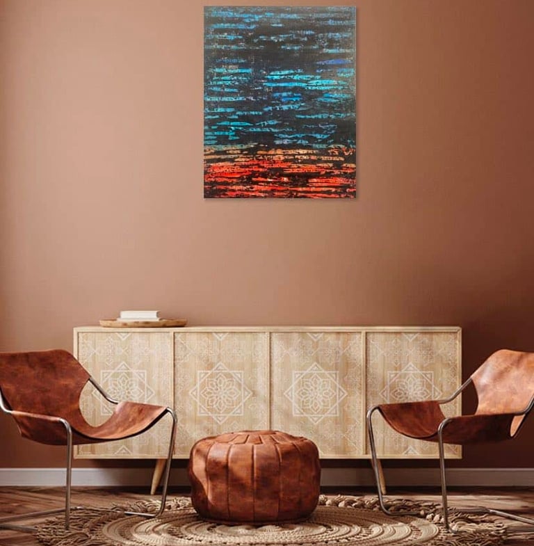 Tableau abstrait turquoise, rouge et noir intitulé "Vibrations colorées" accroché dans un décor