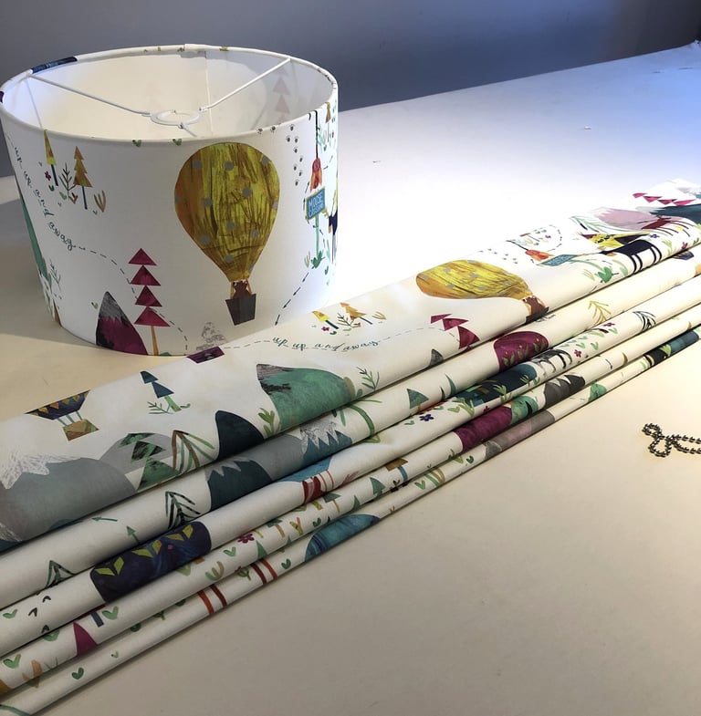 A hand sewn blind with a matching lampshade