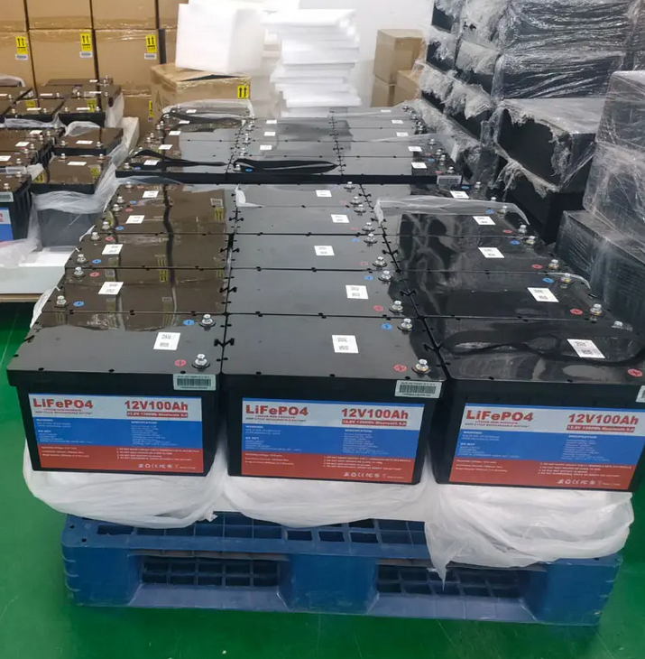 multiple 12 volt 100Ah lithium batteries stacked together in the manufacturing plant