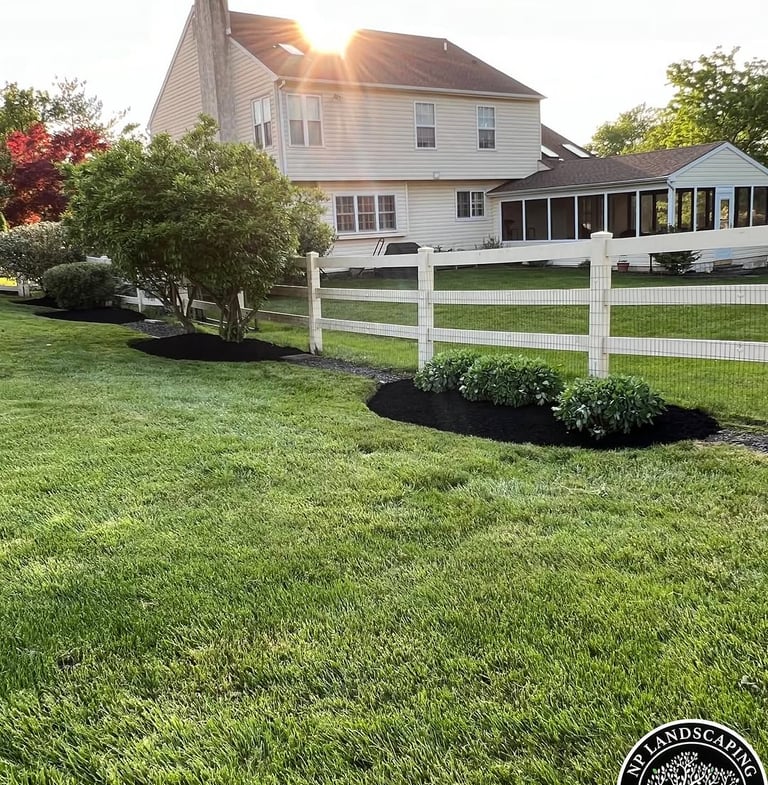 excellent landscaping and hardscaping of grass, stones and trees by NP Landscaping