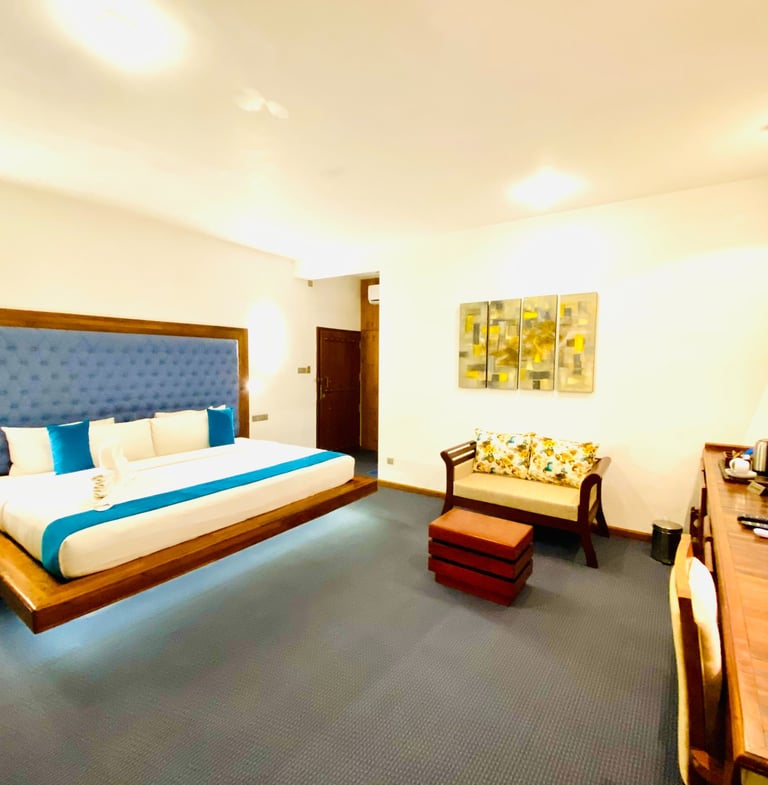 a bedroom with a bed and a desk