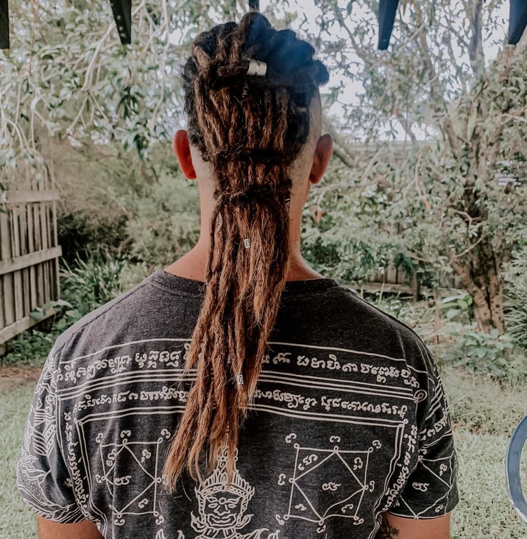 a man with dreadlocks and dreadlocks on his hair