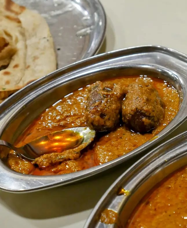 Traditional Gulab Jamun ki Sabji from Jodhpur, a unique Rajasthani curry blending sweet and spicy flavors.