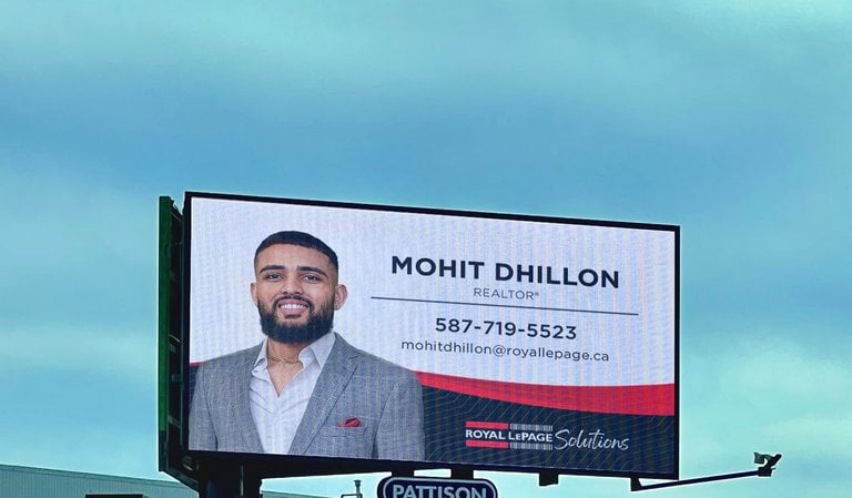 a billboard board with a picture of a man on a billboard