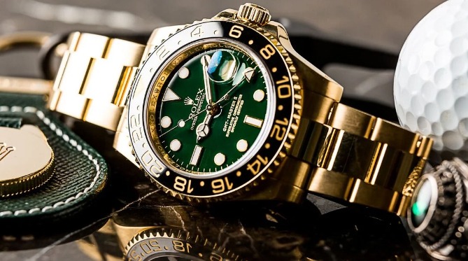 a watch with a golf ball and a golf ball