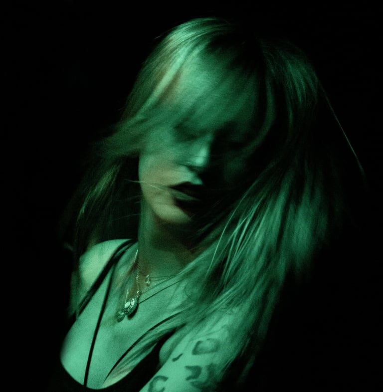 a woman with tattoos on her arm and a tattoo on her arm