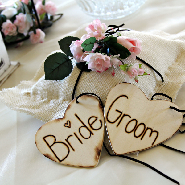 bride and groom is written on the wooden piece 