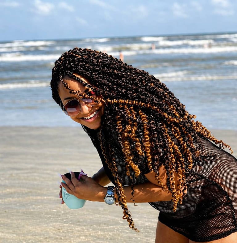 A woman with passion twist hairstyle made by kiki houston