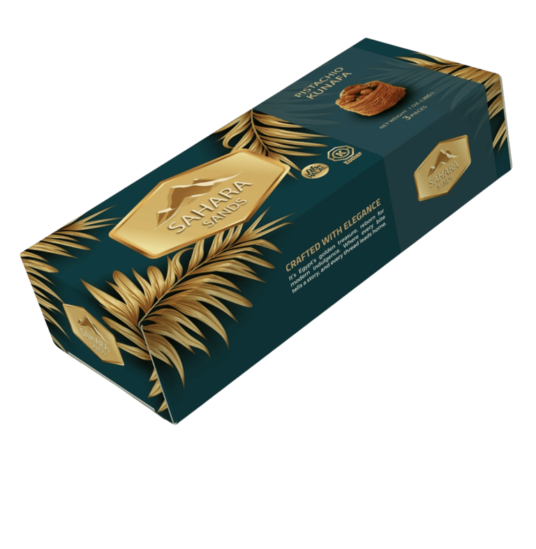 Sahara Sands Pistachio Kunafa gourmet gift box with gold leaf patterns on a teal background.