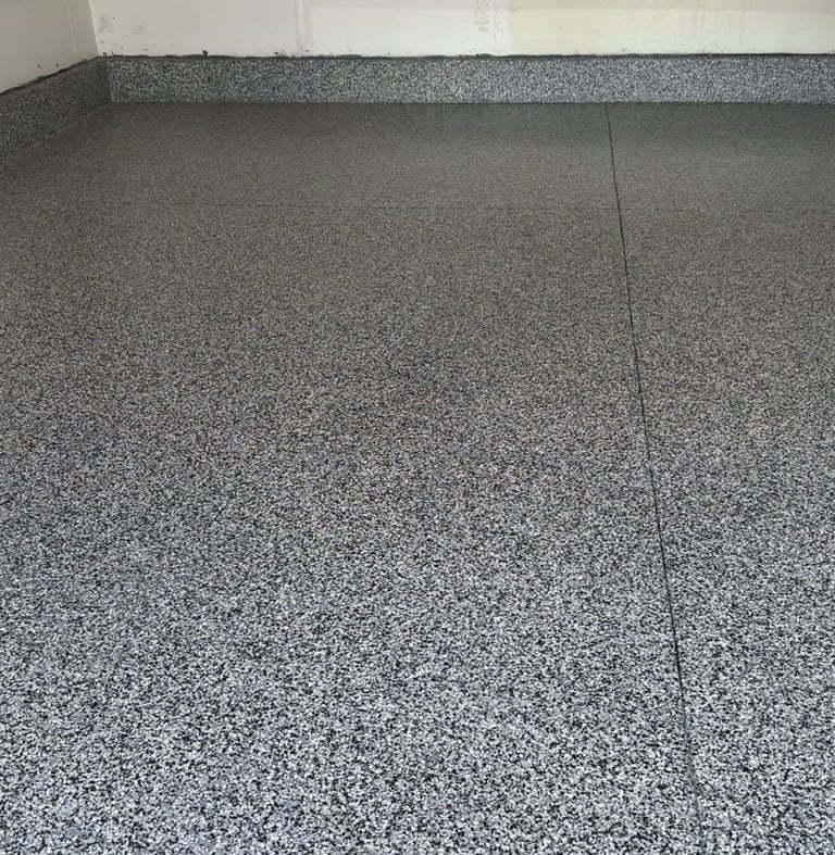 After of Home garage with domino flake floor in Grand Island home.