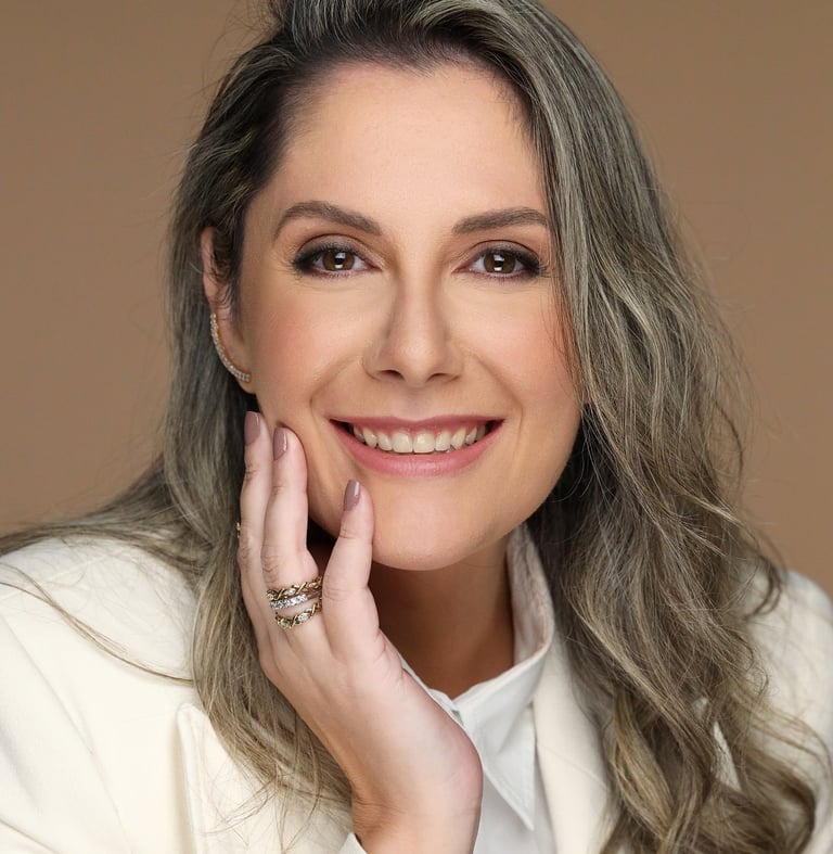 a woman with long hair and a white jacket