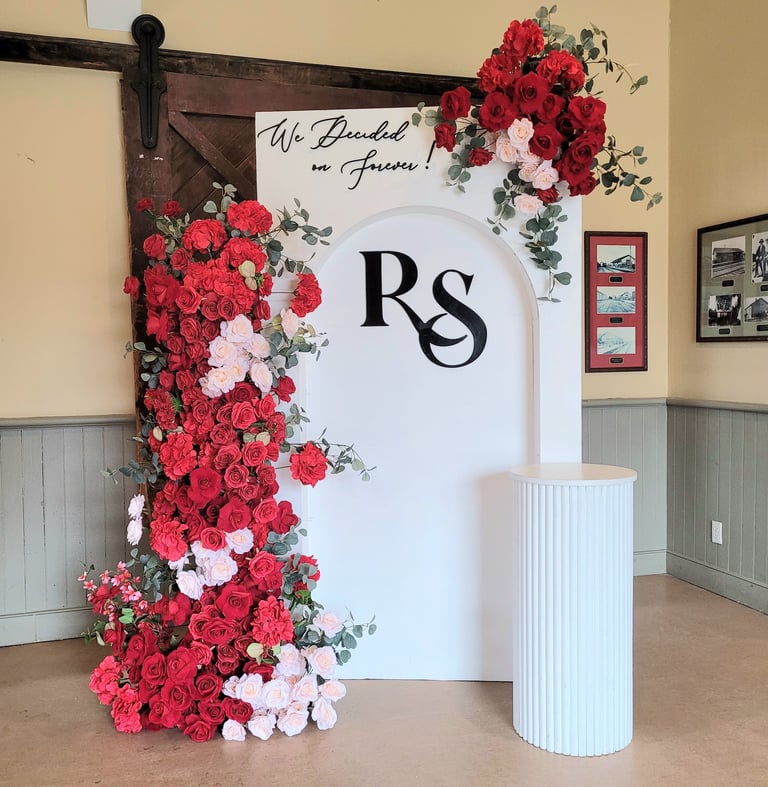 Red floral arrangement with custom made initials with red floral arrangements