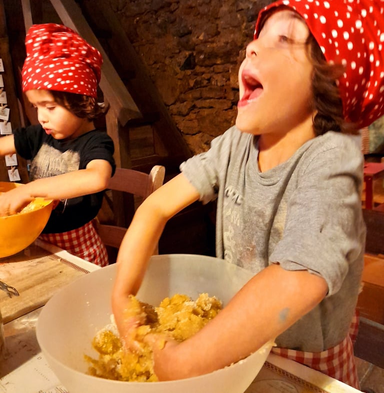 Children baking Christmas cookies in The Glass Room at Nature Dream Days