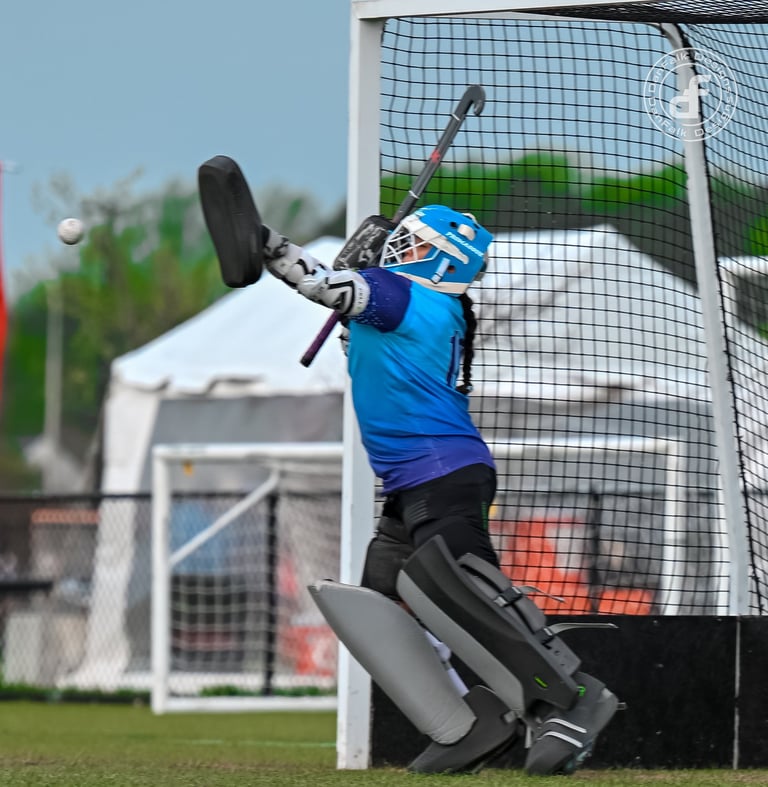 a field hockey goalie playing a shot from Surge Field Hockey