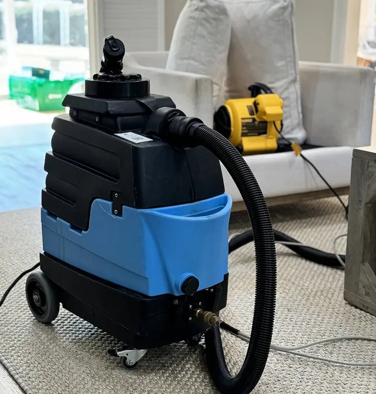 Founder of Rocky Clean is cleaning couch in Denver, CO