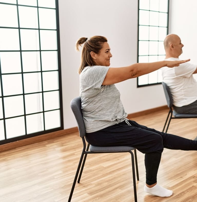 Chair yoga with arms and legs straight out to train core