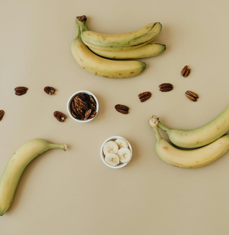 bananas and pecans on a table with nuts