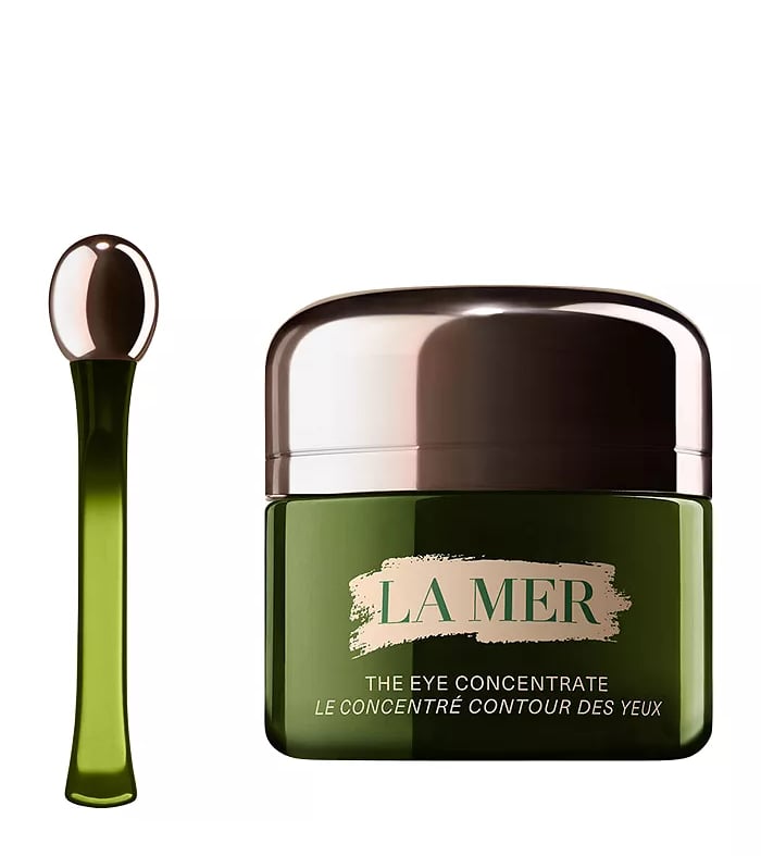 La Mer The Eye Concentrate cream jar with silver lid and matching applicator wand for anti-aging skincare.