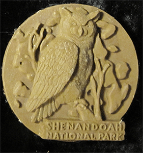 2-d clay sculpture For Shenandoah of Owl with moon back drop