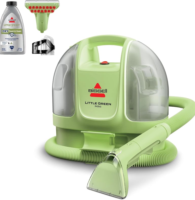 a little green vacuum cleaner with a bottle of cleaner