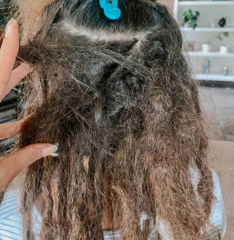 a woman with dreadlocks that have joined at the root