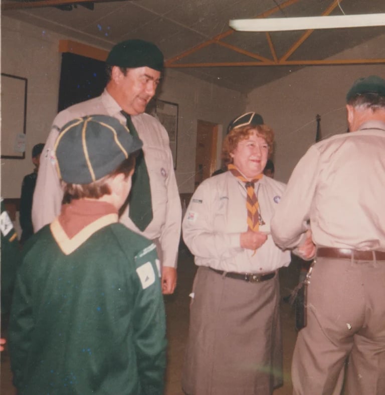 cub and scouts leaders in a hut