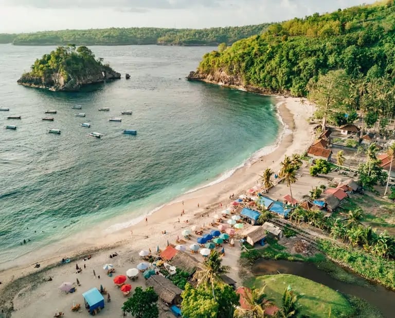 Aerial view of Crystal Bay Beach in Nusa Penida Bali with white sand and turquoise water.