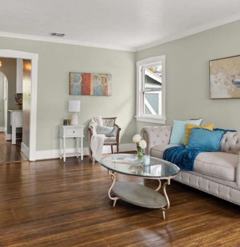 after luxury staging: a living room with a couch and a table