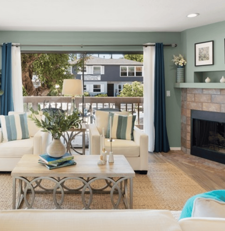 A staged living with luxurious furniture and accessories