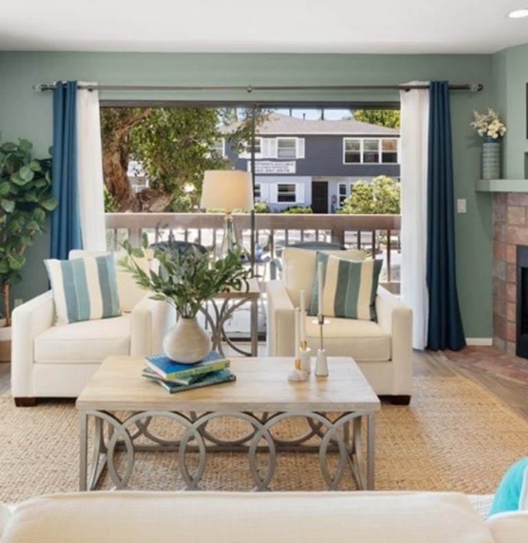 A staged living with luxurious furniture and accessories