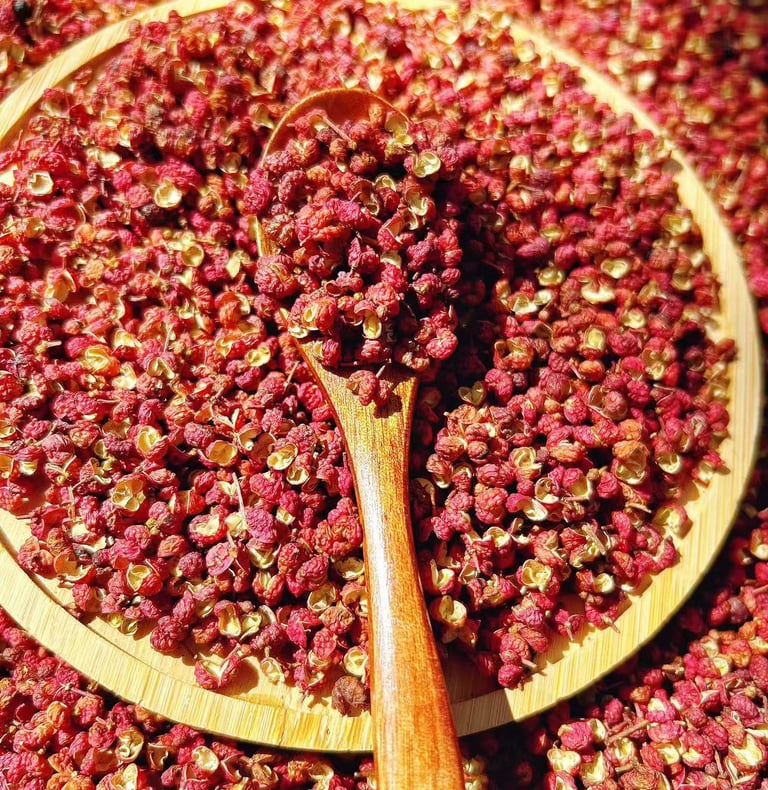 a wooden spoon with Sichuan Pepper