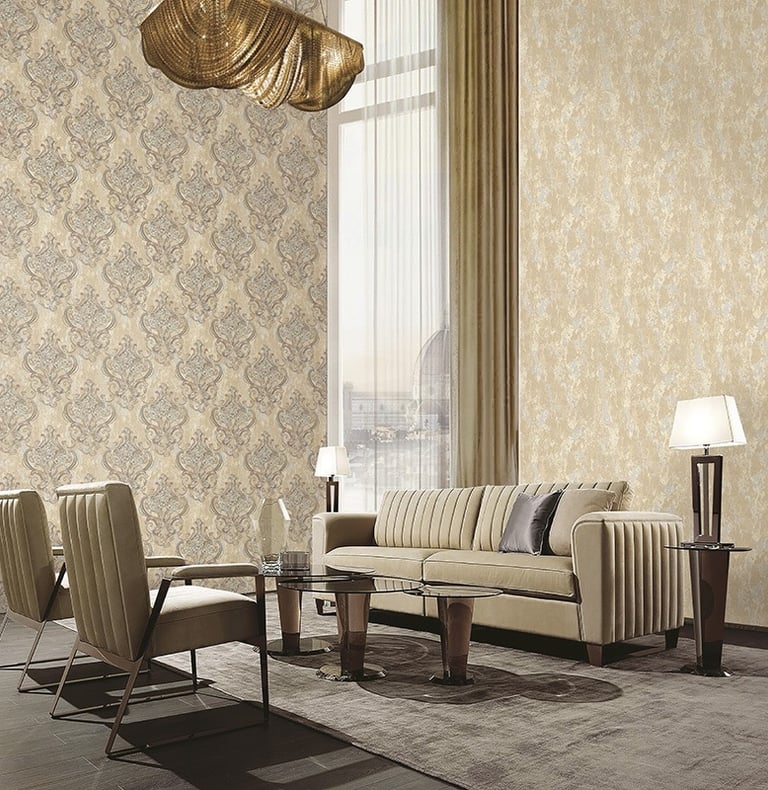 Elegant living room featuring luxury damask wallpaper, a modern beige sofa, and gold chandeliers.