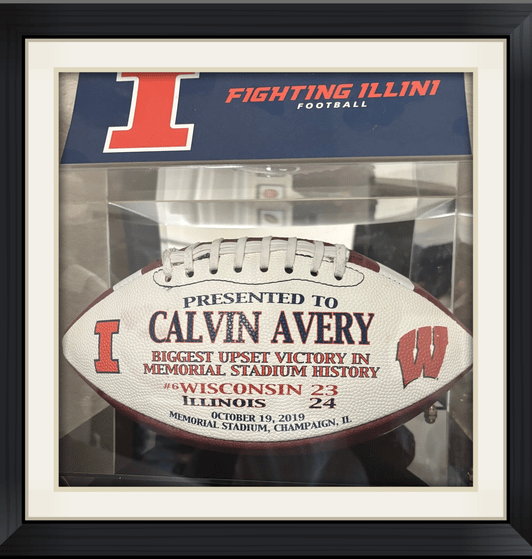 Calvin Avery received a game football for outstanding play against the Univ. of Wisconsin. 