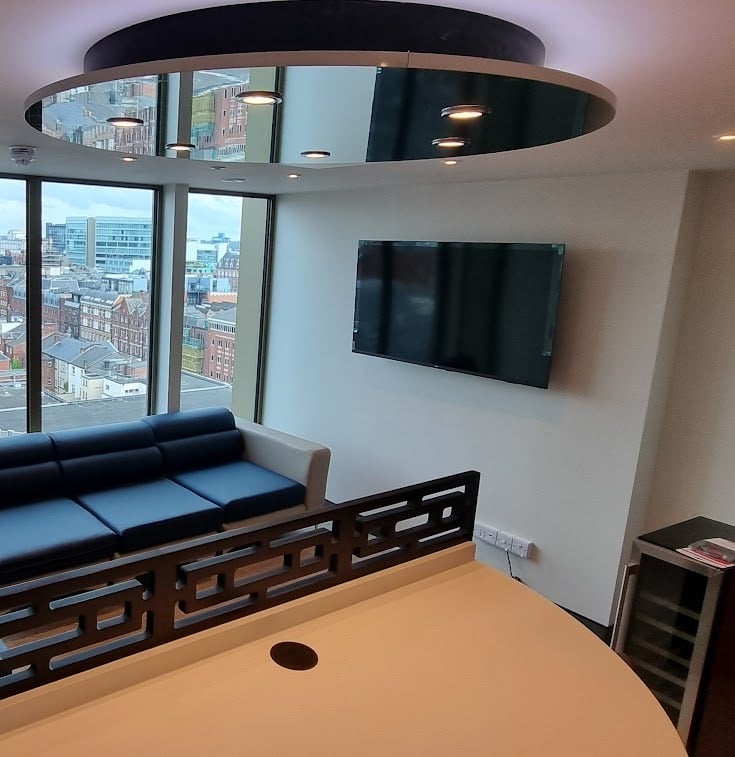 MountMyTV - Phillips 65" TV mounted on a wall in a university communal area