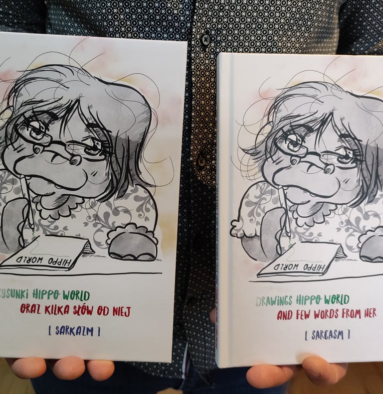 a person holding two cards with a drawing of a girl