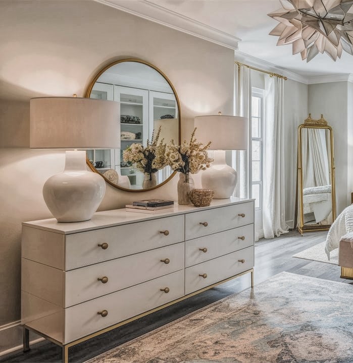 a bedroom with a large bed and a large mirror
