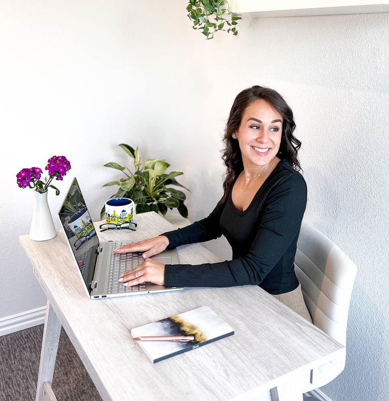 Professional writer at writing at a desk and smiling