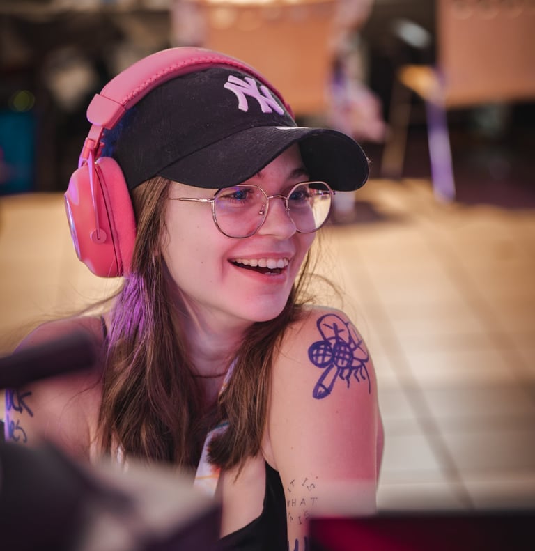 a woman with a baseball cap and headphones