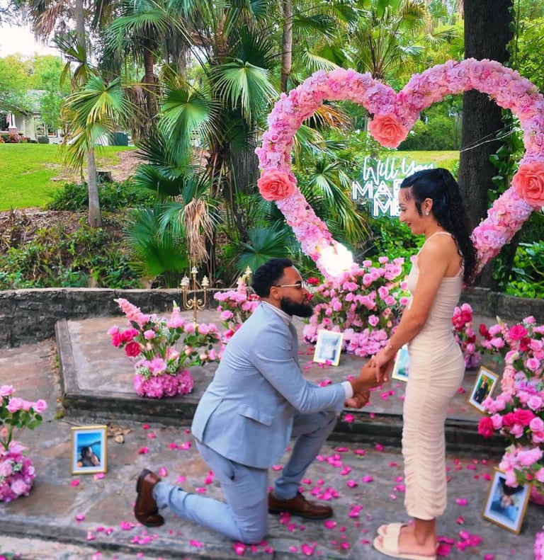 Intimate garden proposal in Orlando with elegant flowers and private photography.