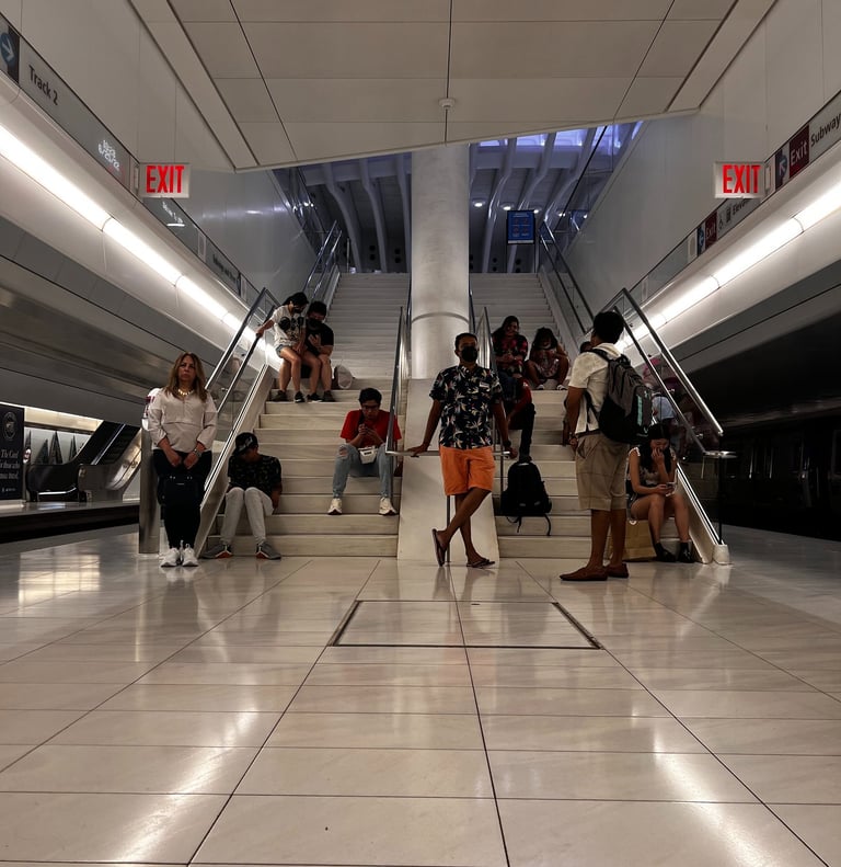a group of people walking down a tiled floor
